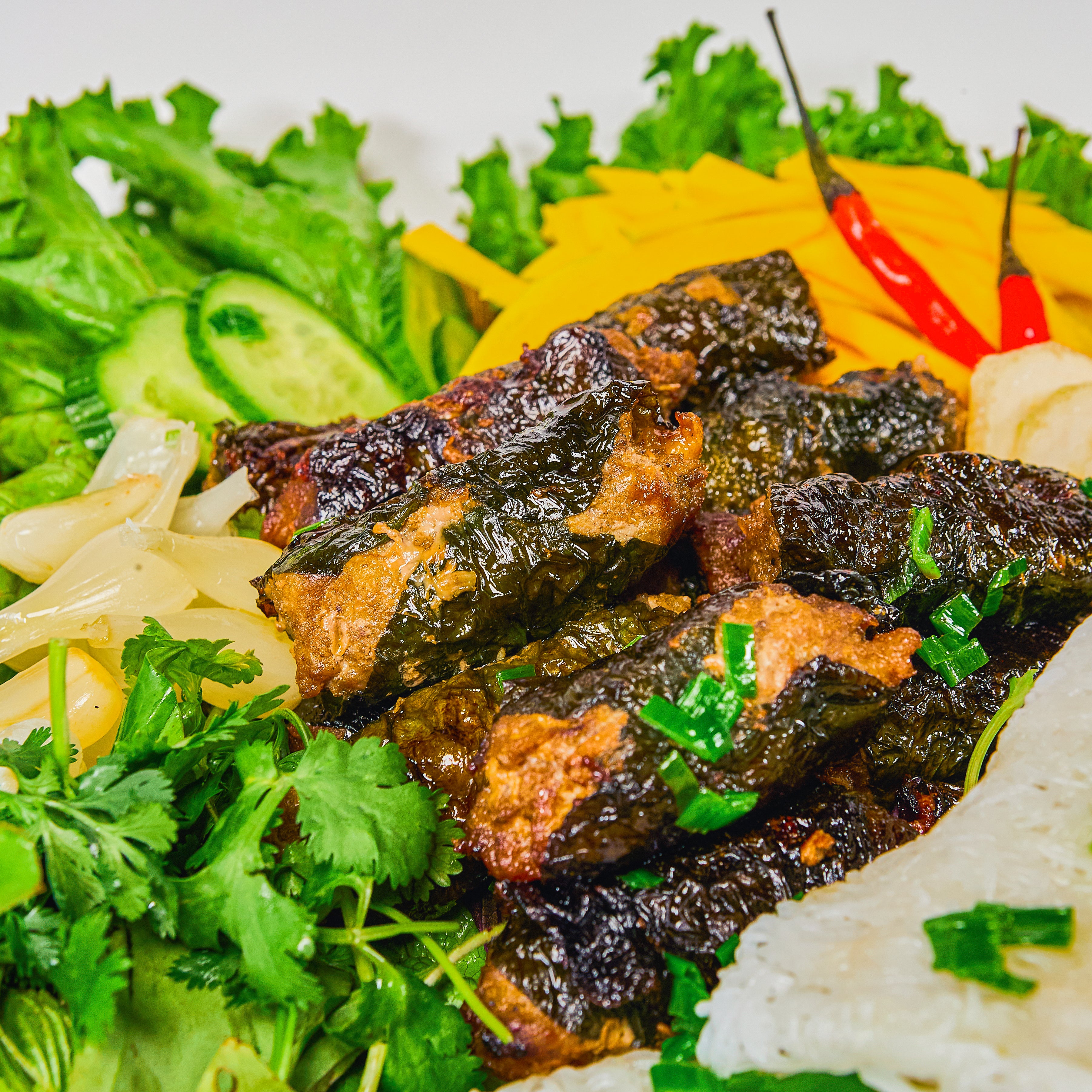 Ground beef wrapped in betel leaves - Bò lá lốt